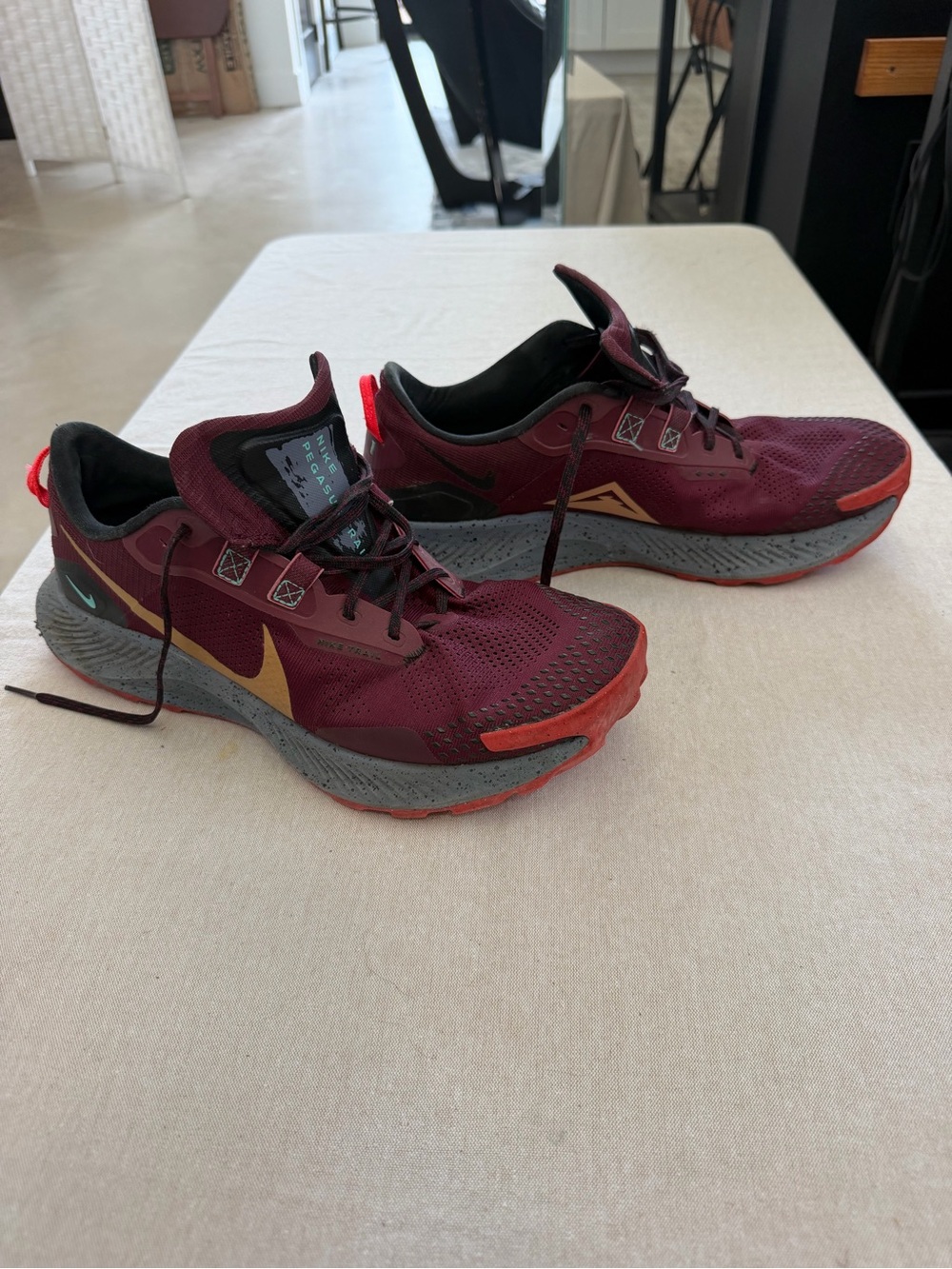 Nike Pegasus Trail shoes. Burgundy with Gold Swoosh and Red Accents